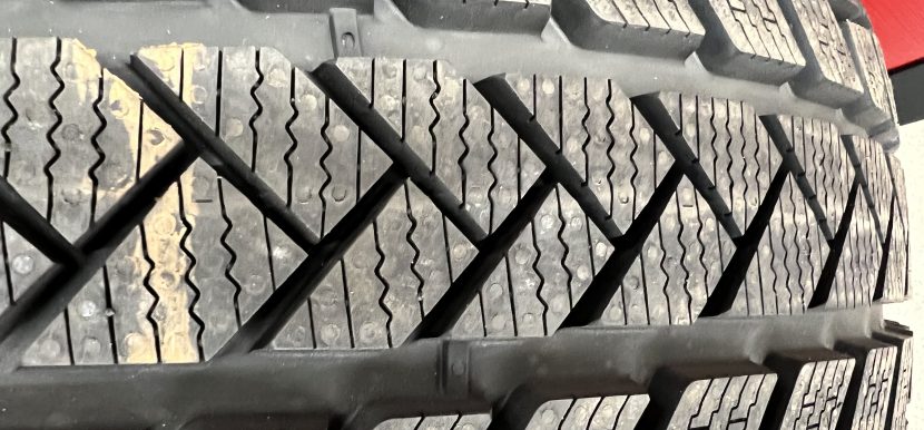 Close-up of snow tire tread demonstrating winter traction design