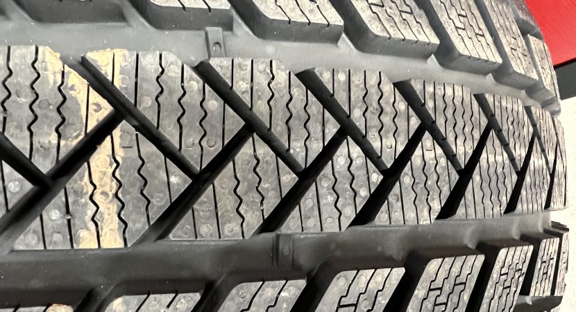 Close-up of snow tire tread demonstrating winter traction design