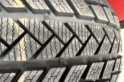 Close-up of snow tire tread demonstrating winter traction design